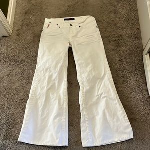 White jeans with wide leg.  Copper accent snaps